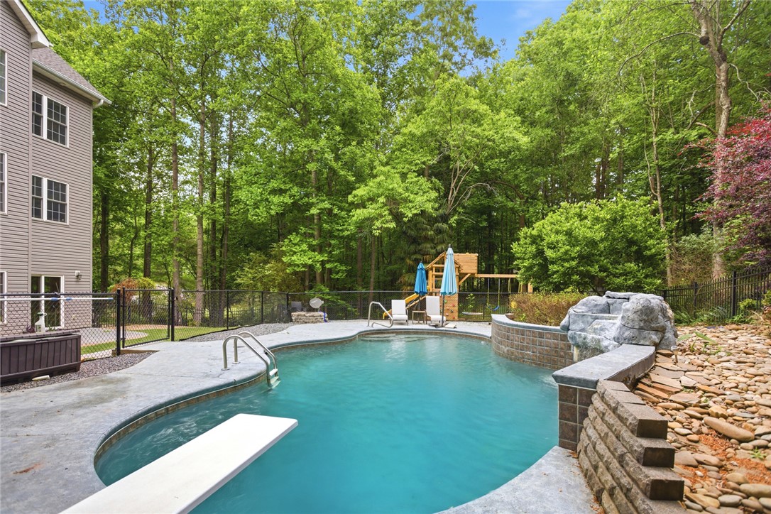 207 Devonhurst Drive Seneca, SC 29678 - Photo 41 of 50 This private outdoor oasis features a refreshing pool, perfect for relaxation and recreation.