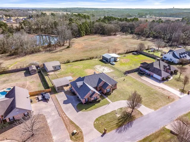 an aerial view of a house with swimming pool