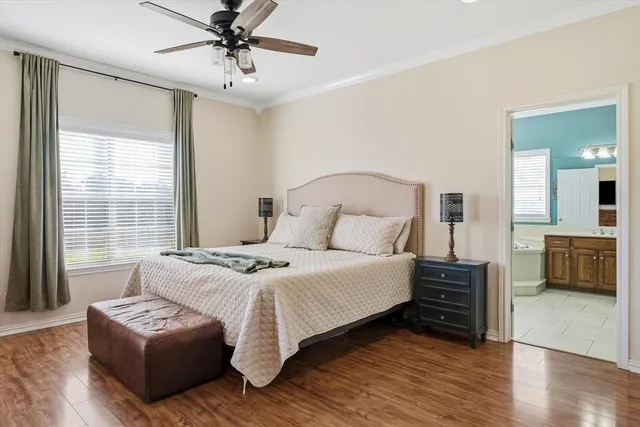 a spacious bedroom with a bed and a couch