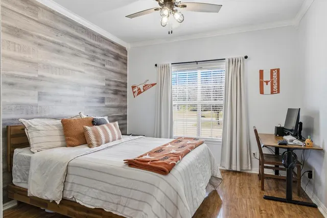 a bedroom with bed and a window