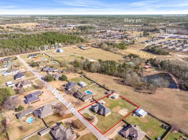 an aerial view of a house with a ocean view