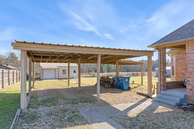 a view of a house with backyard and porch