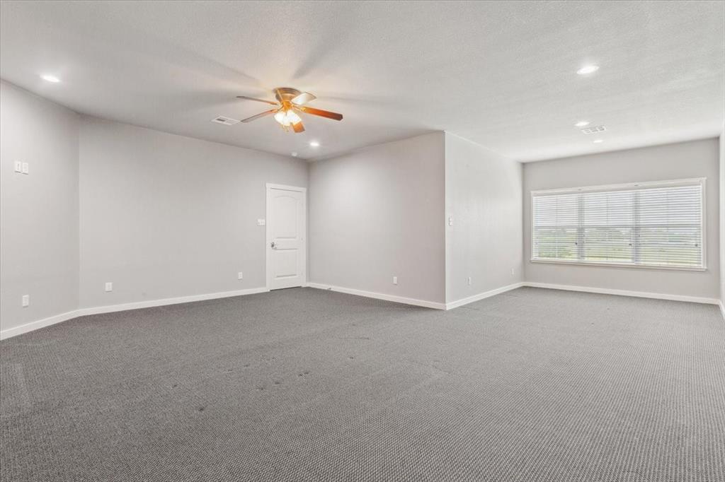259 County Road 149 Riesel, TX 76682 - Photo 26 of 40 Spare room with ceiling fan, recessed lighting, baseboards, and dark colored carpet