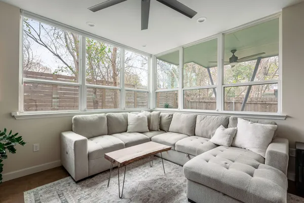 a living room with furniture and a large window