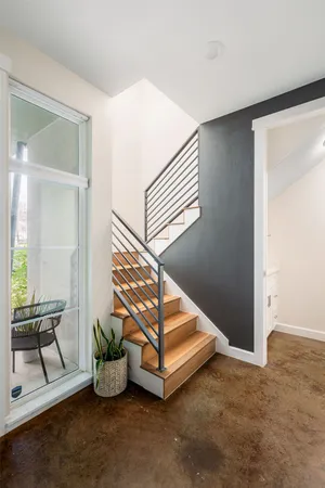 a view of an empty room and wooden floor