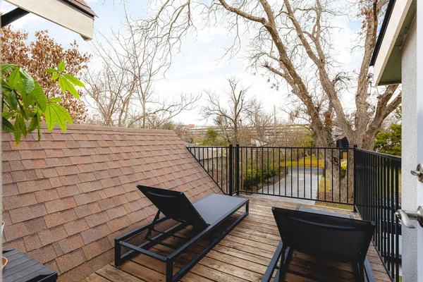 a view of a patio with wooden floor
