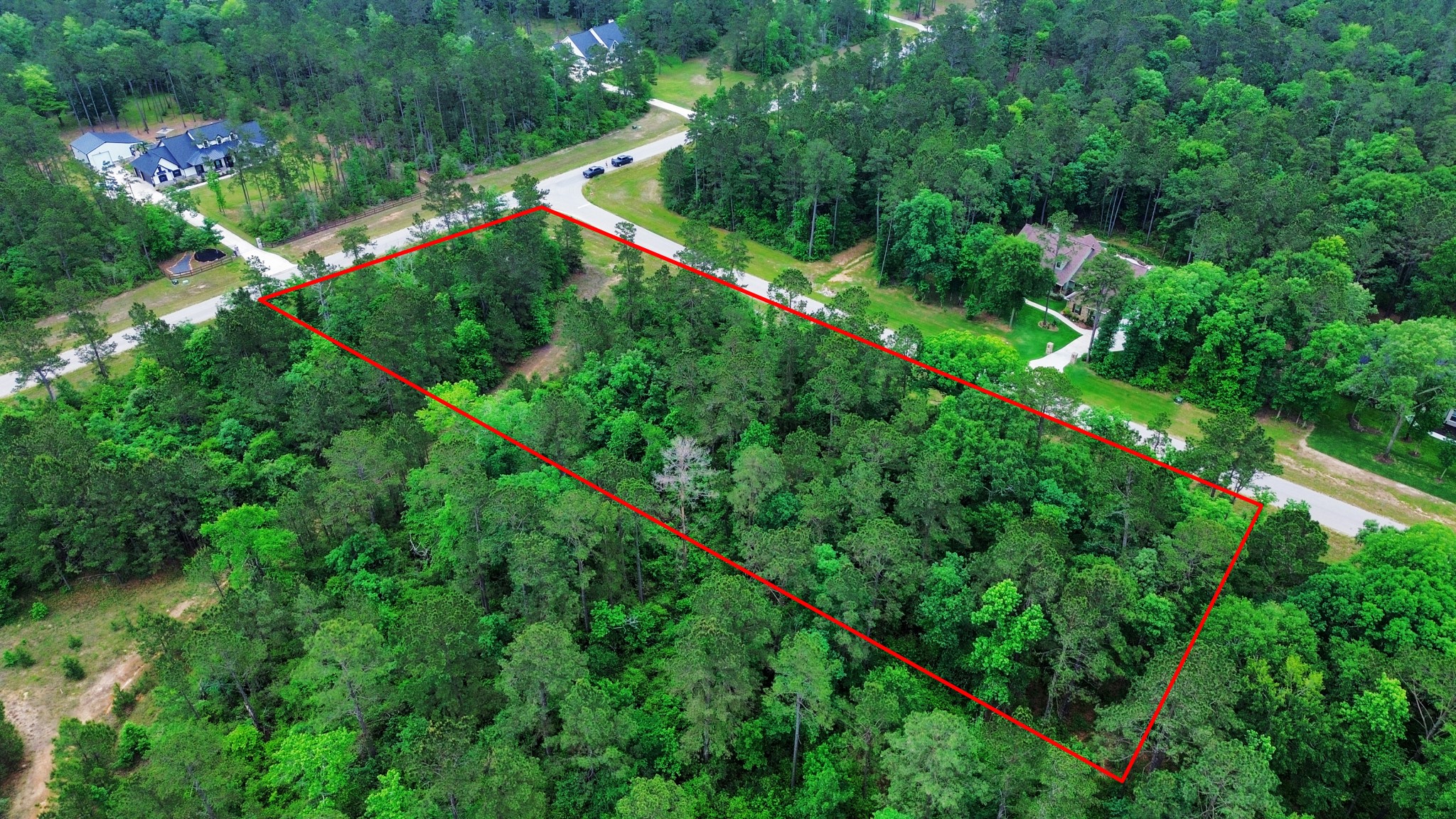 10517 Single Shot Lane Willis, TX 77378 - Photo 41 of 42 an aerial view of residential house with outdoor space and trees all around