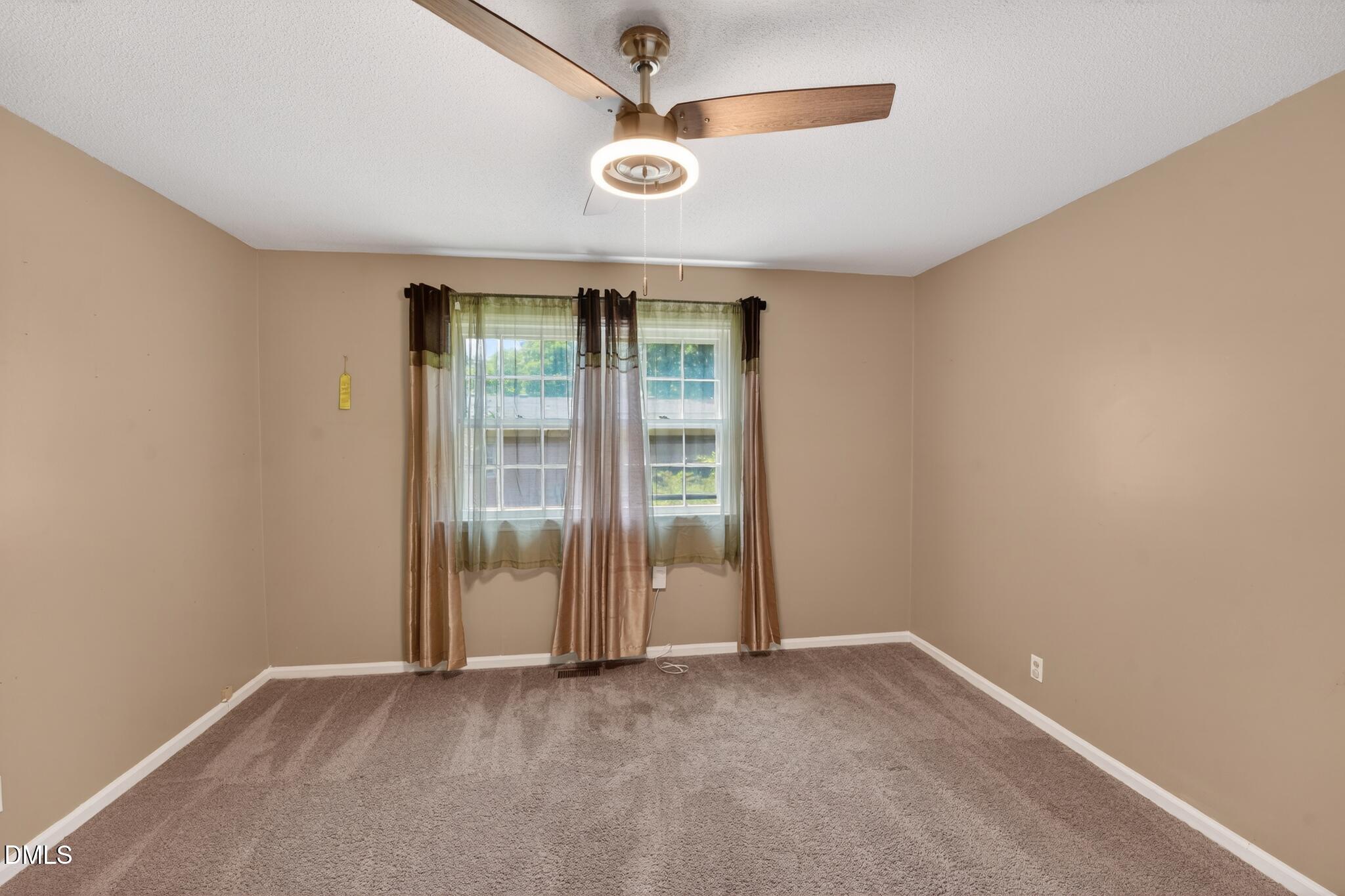 1034 Jerome Road Durham, NC 27713 - Photo 7 of 35 an empty room with windows