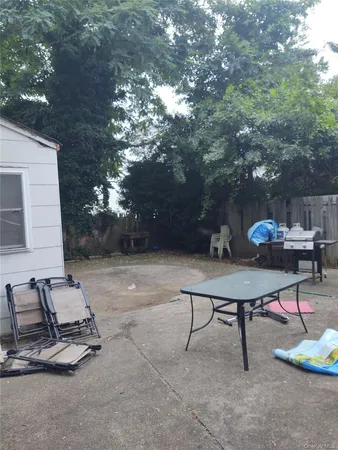 a view of a backyard with furniture