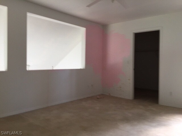 18312 Lee Road Fort Myers, FL 33967 - Photo 13 of 16 an empty room with a window