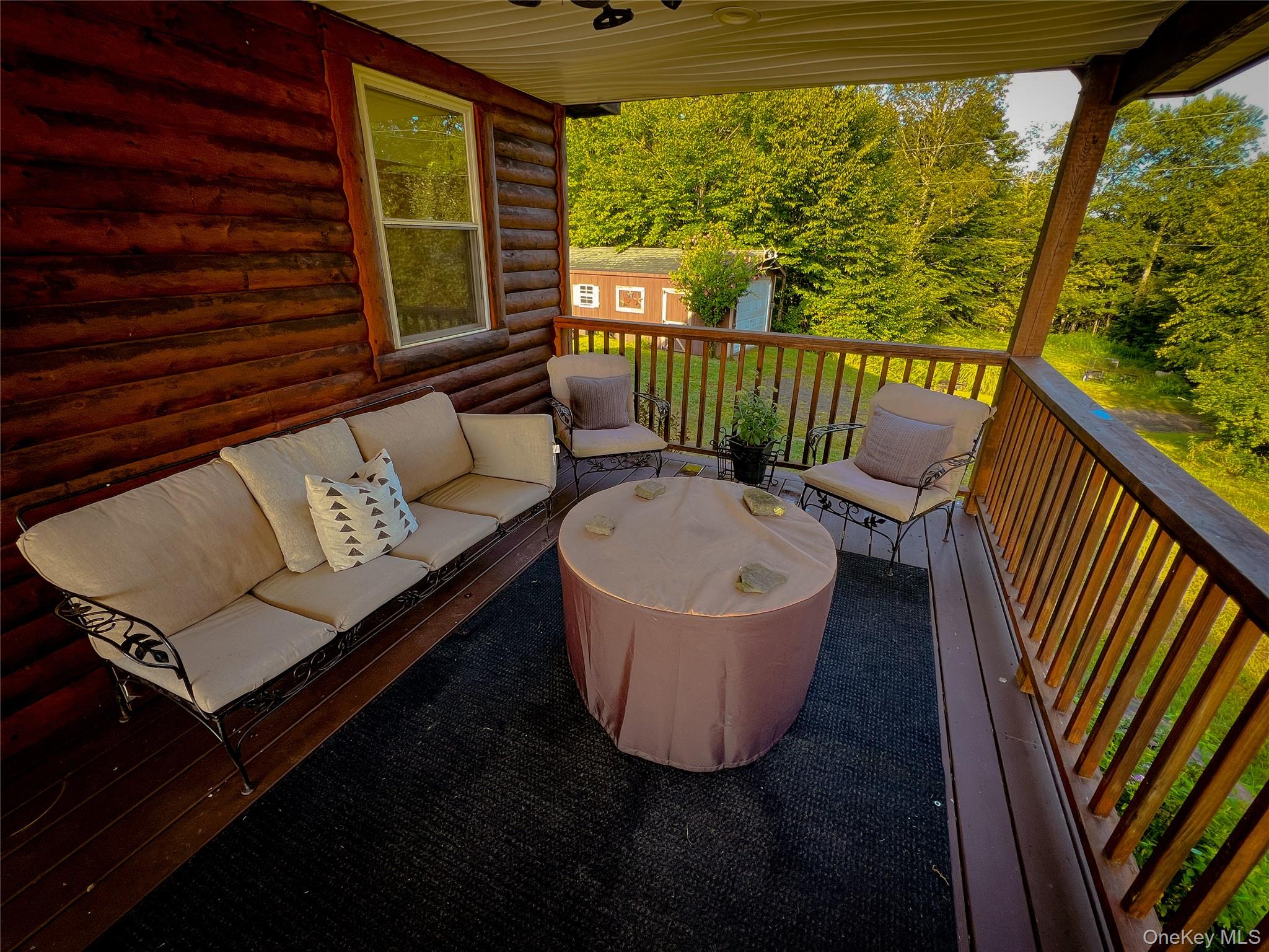 295 Emerald Heights Road Delancey, NY 13752 - Photo 11 of 30 Covered balcony featuring a wood-finish floor and natural wood railing