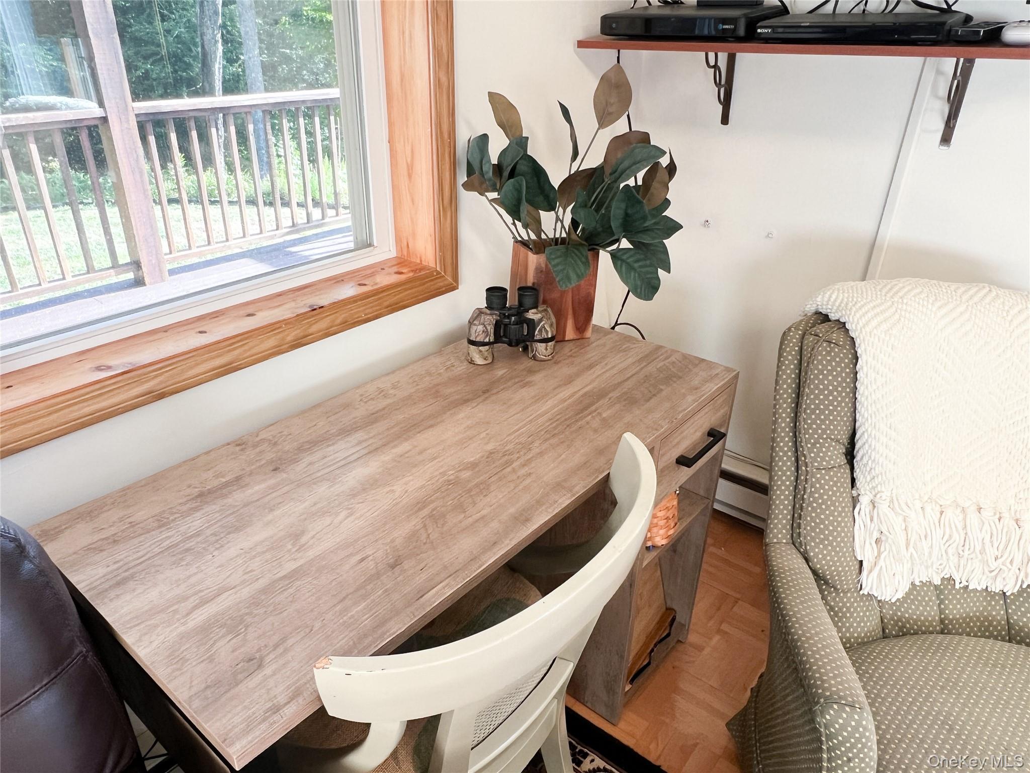 295 Emerald Heights Road Delancey, NY 13752 - Photo 16 of 30 Wood-finish desktop with integrated storage, wood-trim window, and light-tone wood flooring