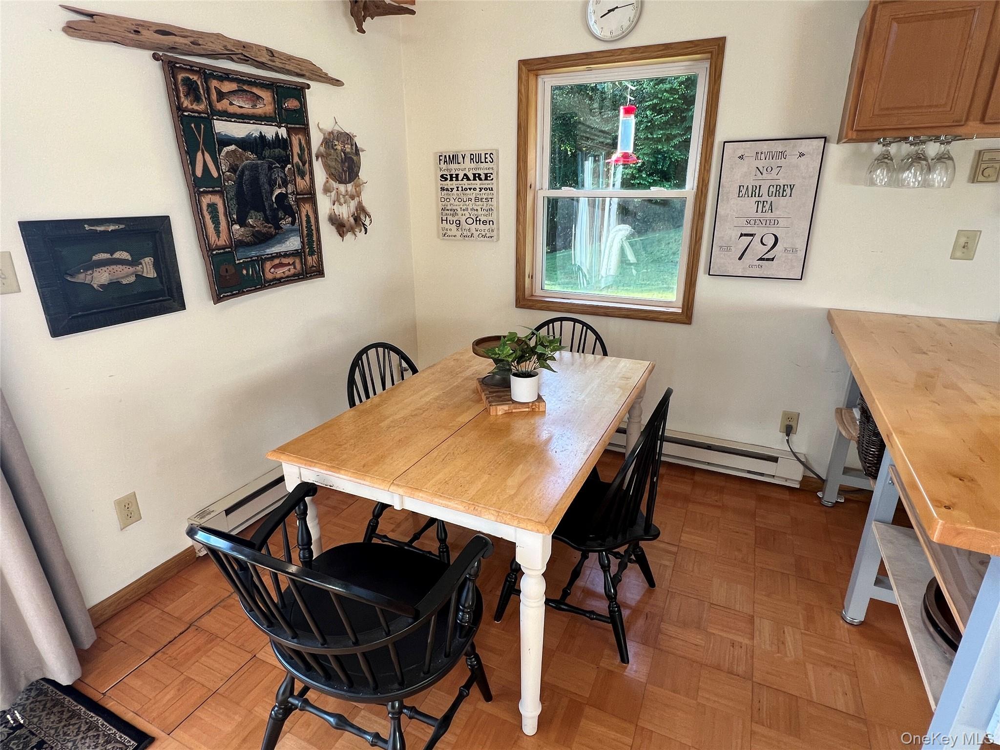 295 Emerald Heights Road Delancey, NY 13752 - Photo 20 of 30 Dining area featuring wood-finish flooring and a wood-framed window