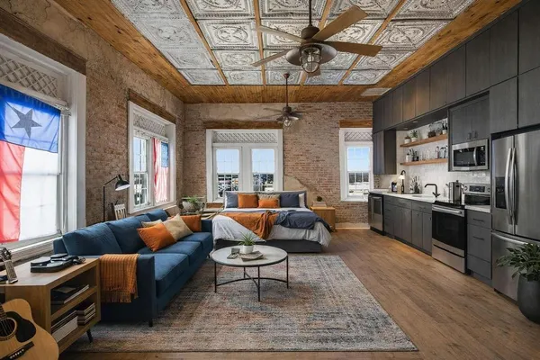 a kitchen with a dining table and chairs