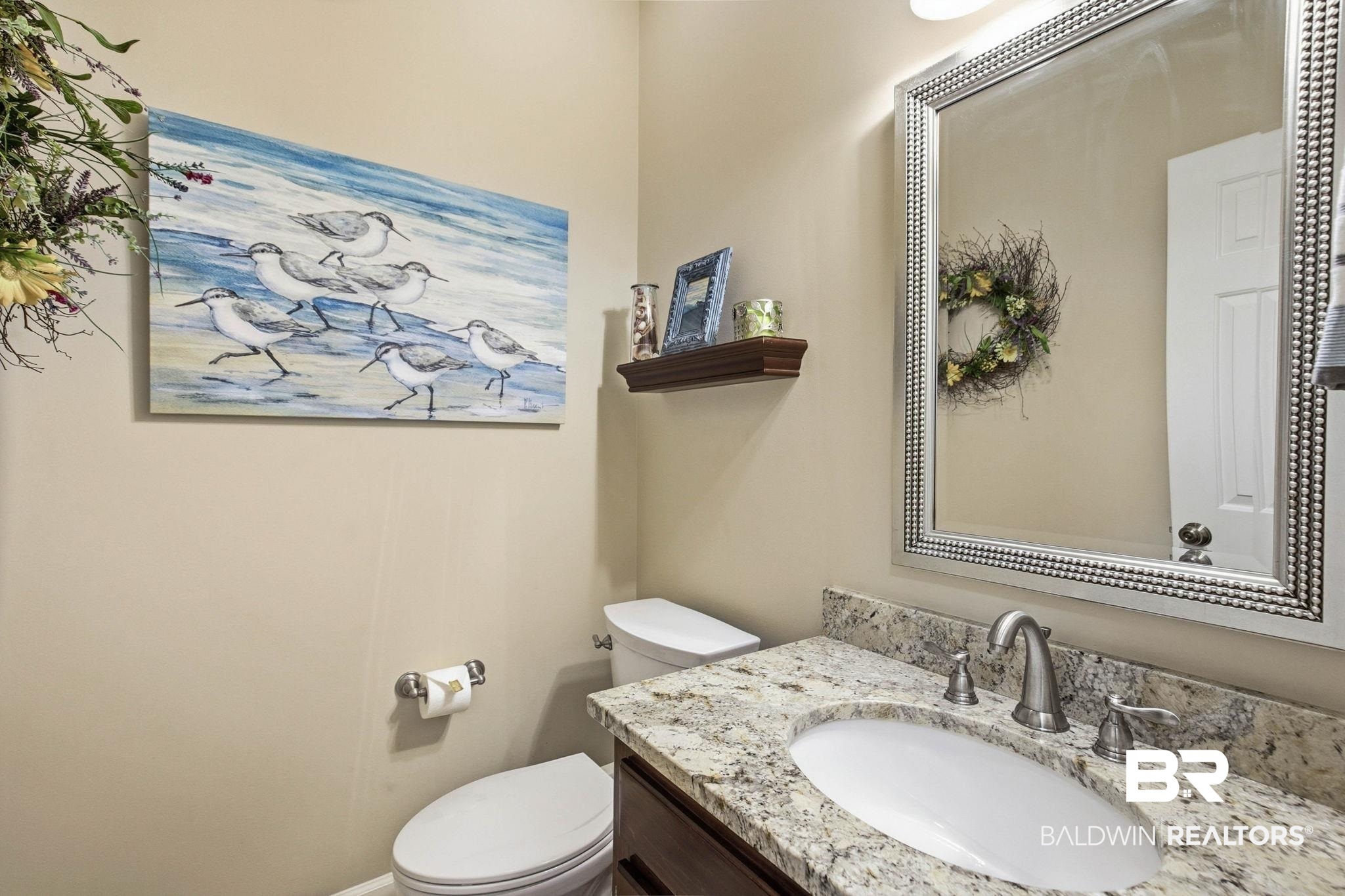 31515 Rhett Drive Spanish Fort, AL 36527 - Photo 27 of 100 The hall half bath is located just off the great room and has updated tile flooring and quartz countertops.