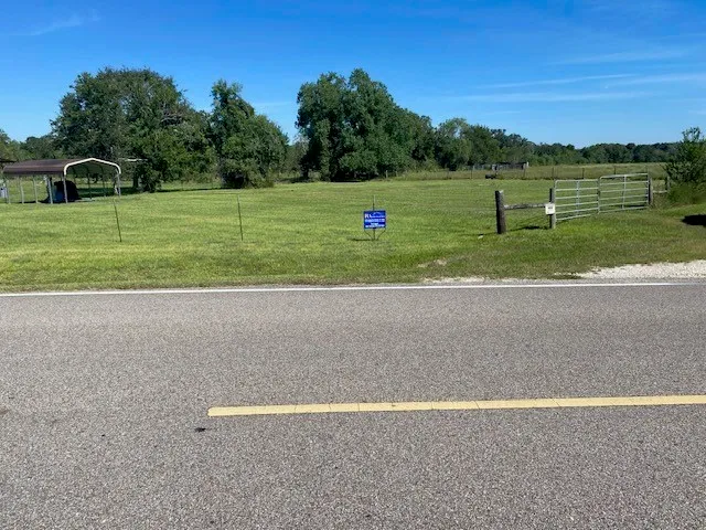 a view of a field with a big yard