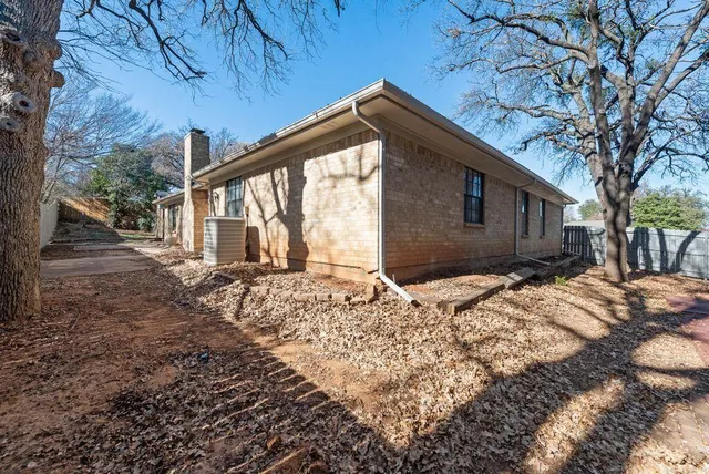 a house with trees in the background