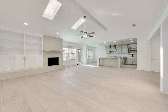 a view of a kitchen with a sink and a stove top oven