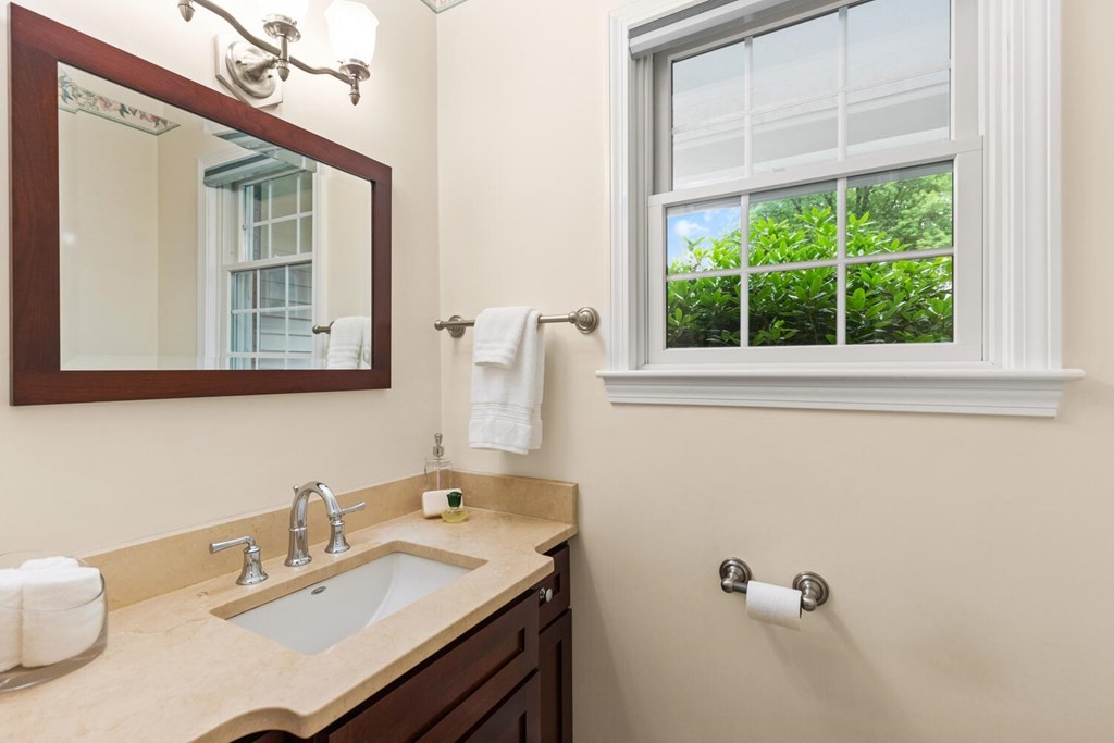 29 Saddle Club Road Lexington, MA 02420 - Photo 11 of 22 a bathroom with a sink vanity and a mirror