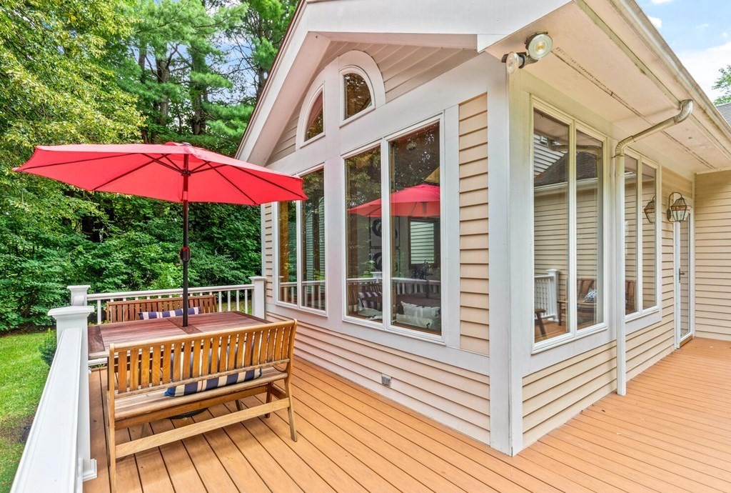 29 Saddle Club Road Lexington, MA 02420 - Photo 21 of 22 a view of a wooden deck with a bench