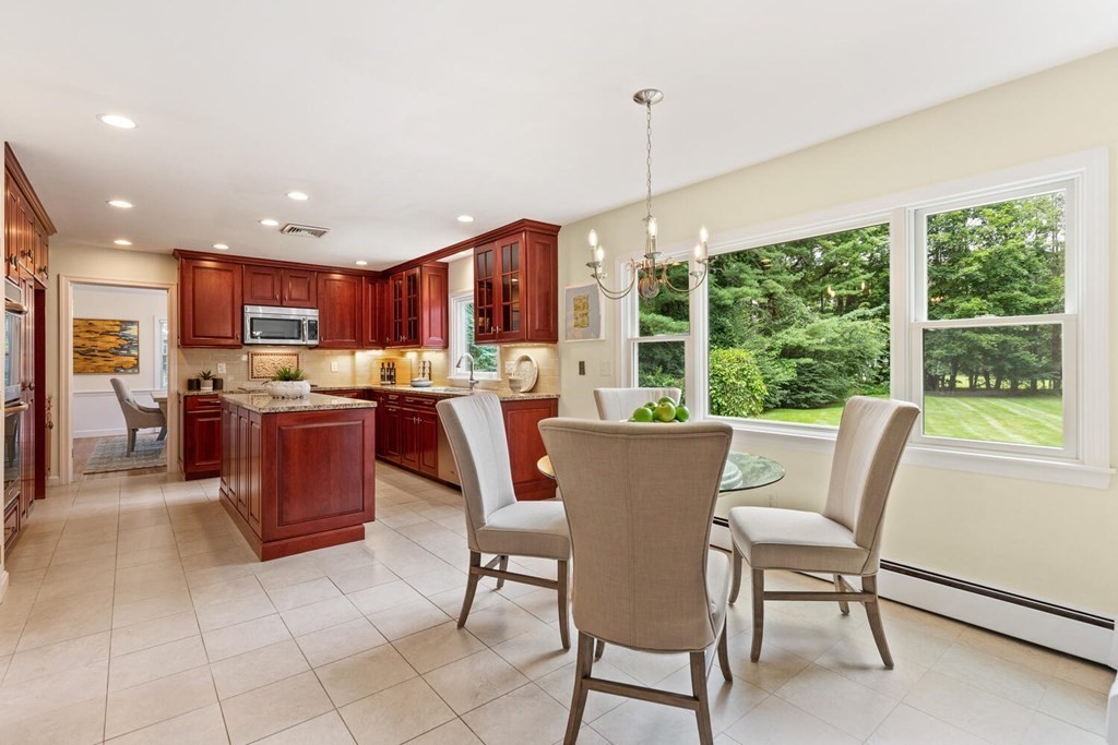 29 Saddle Club Road Lexington, MA 02420 - Photo 6 of 22 a living room with a large window and a table