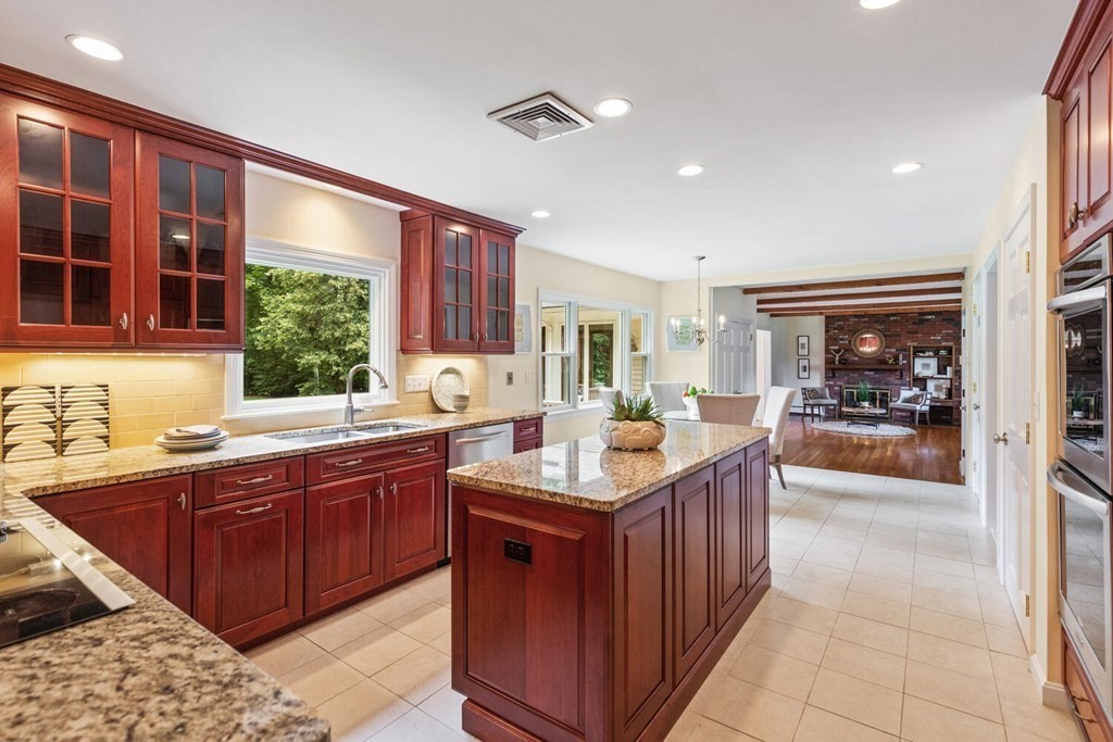 29 Saddle Club Road Lexington, MA 02420 - Photo 7 of 22 a kitchen with large cabinets a sink and appliances