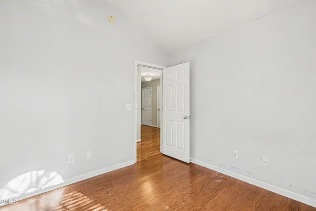 a view of a balcony with wooden floor