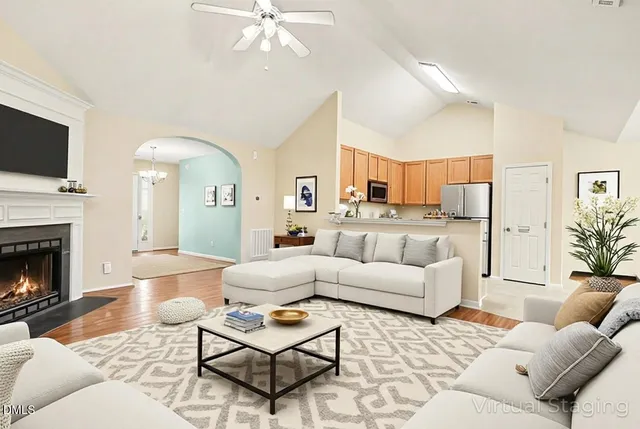 a living room with furniture and a fireplace