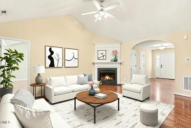 a living room with furniture and a fireplace