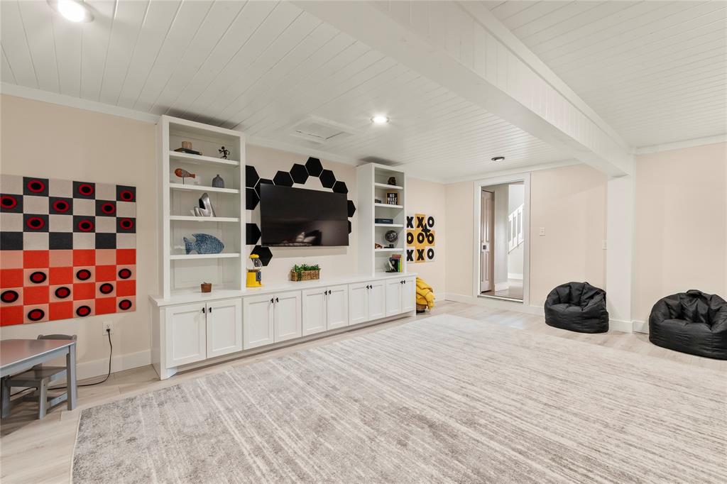 125 Xit Ranch Road Trinidad, TX 75163 - Photo 12 of 34 a bedroom with furniture and a flat screen tv