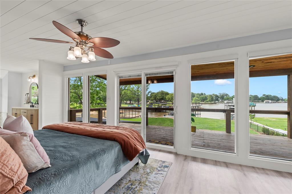 125 Xit Ranch Road Trinidad, TX 75163 - Photo 16 of 34 a bedroom with a large bed and a large window