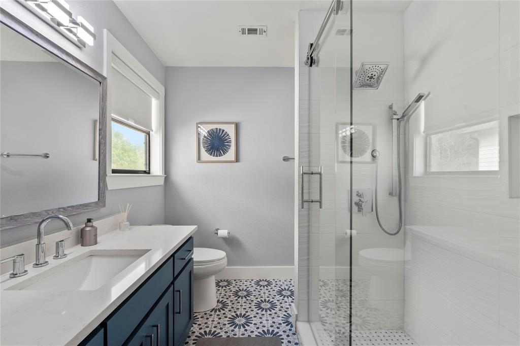 125 Xit Ranch Road Trinidad, TX 75163 - Photo 24 of 34 a bathroom with a sink a toilet and shower