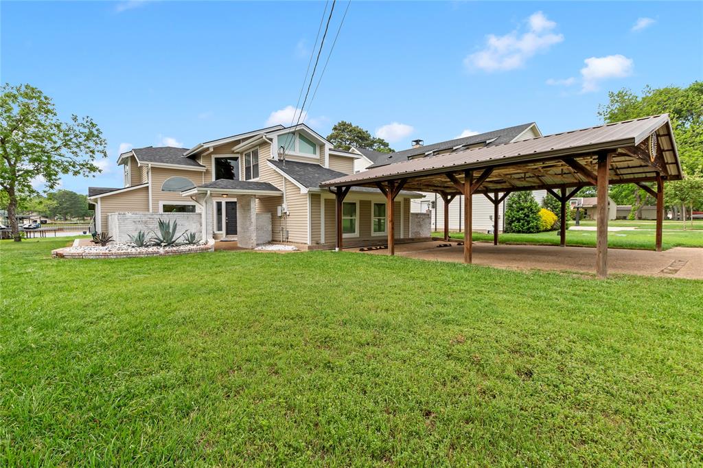 125 Xit Ranch Road Trinidad, TX 75163 - Photo 33 of 34 a view of a house with a yard and sitting area
