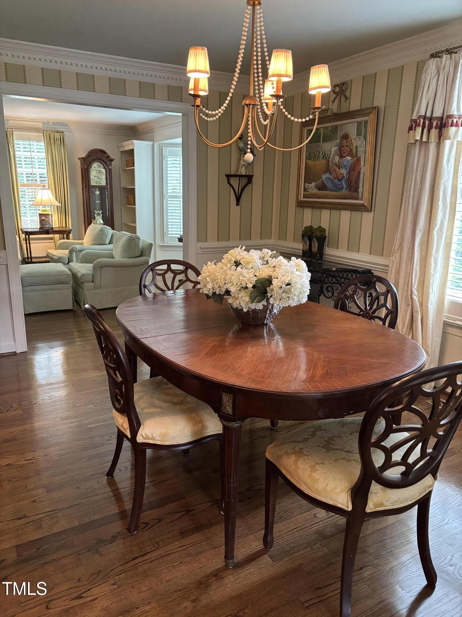 9301 Brookton Court Raleigh, NC 27615 - Photo 12 of 29 a view of a dining room with furniture and wooden floor