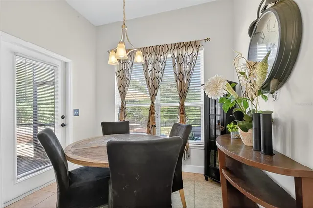 a bedroom with a bed window and couch