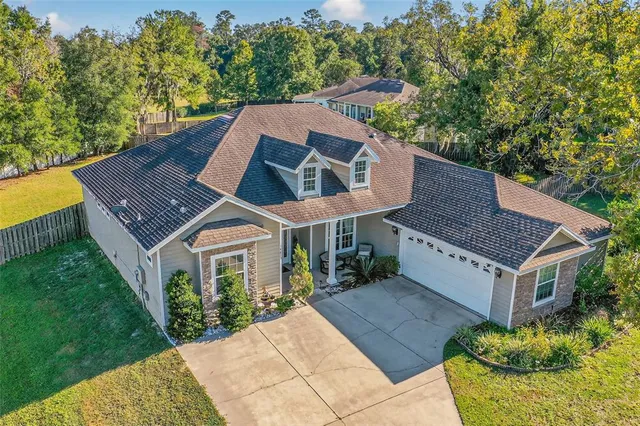 a aerial view of a house with a yard