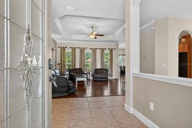 a lobby with furniture and floor to ceiling windows