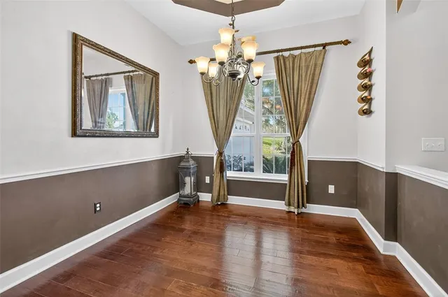 a view of a bedroom with window and furniture