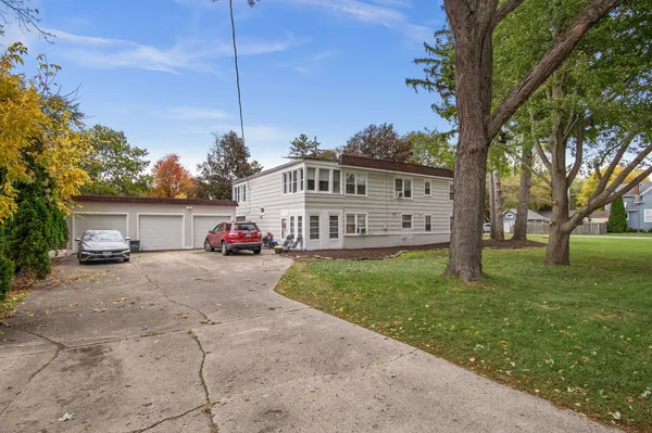 a view of a house with a yard