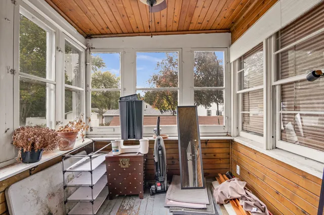 a room with furniture and large windows
