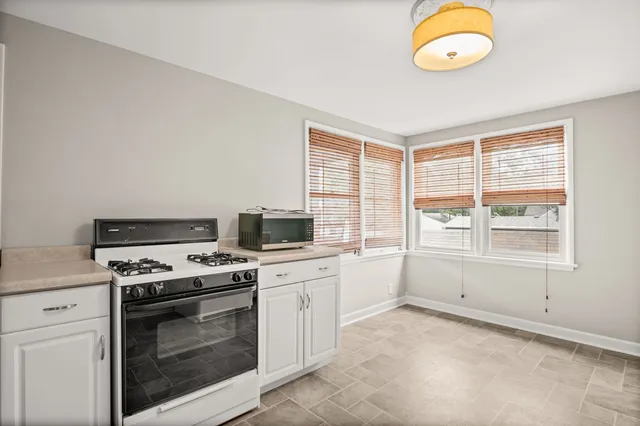 a kitchen with a stove and a sink