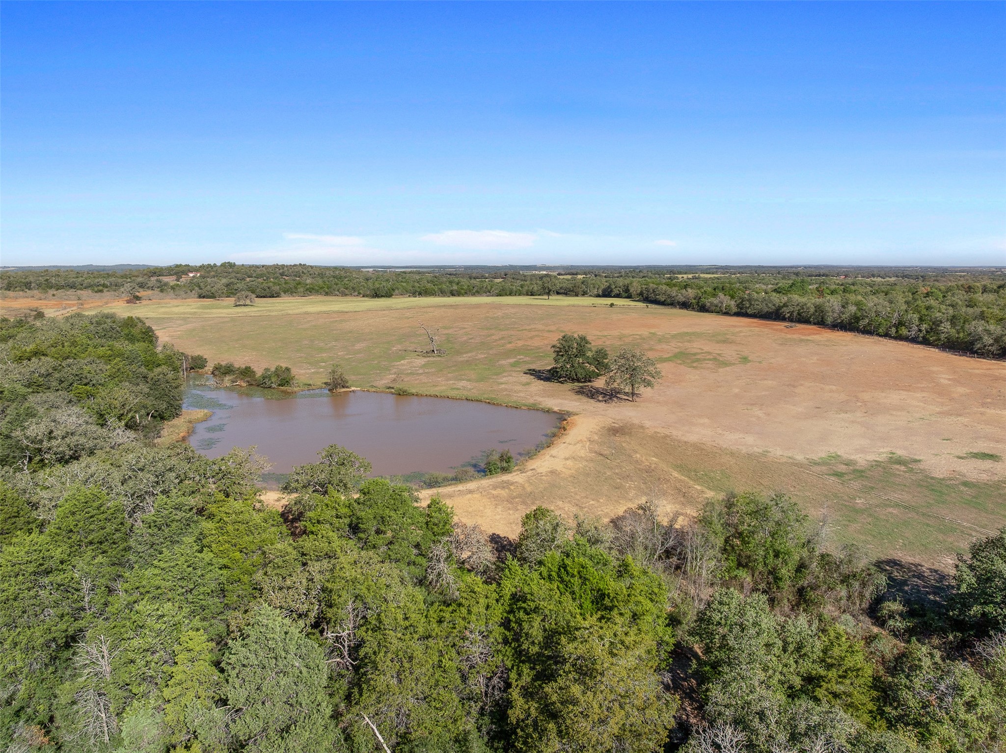 0 Stockade Ranch Road Paige, TX 78659 - Photo 29 of 40 an aerial view of ocean with residential house and outdoor space