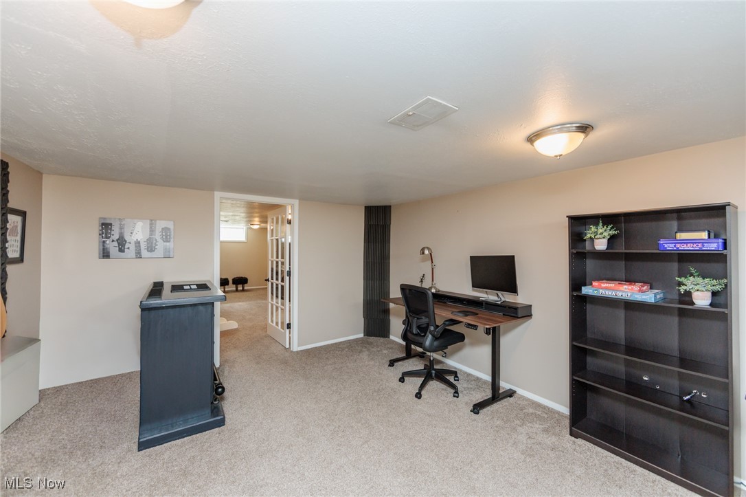 7316 Oakwood Road Parma, OH 44130 - Photo 23 of 41 Home office with light carpet and baseboards