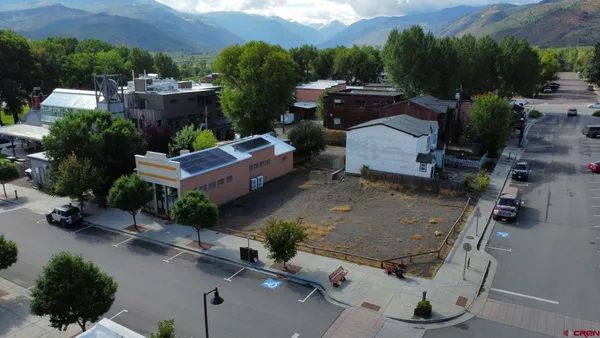 a view of a car park in front of the house
