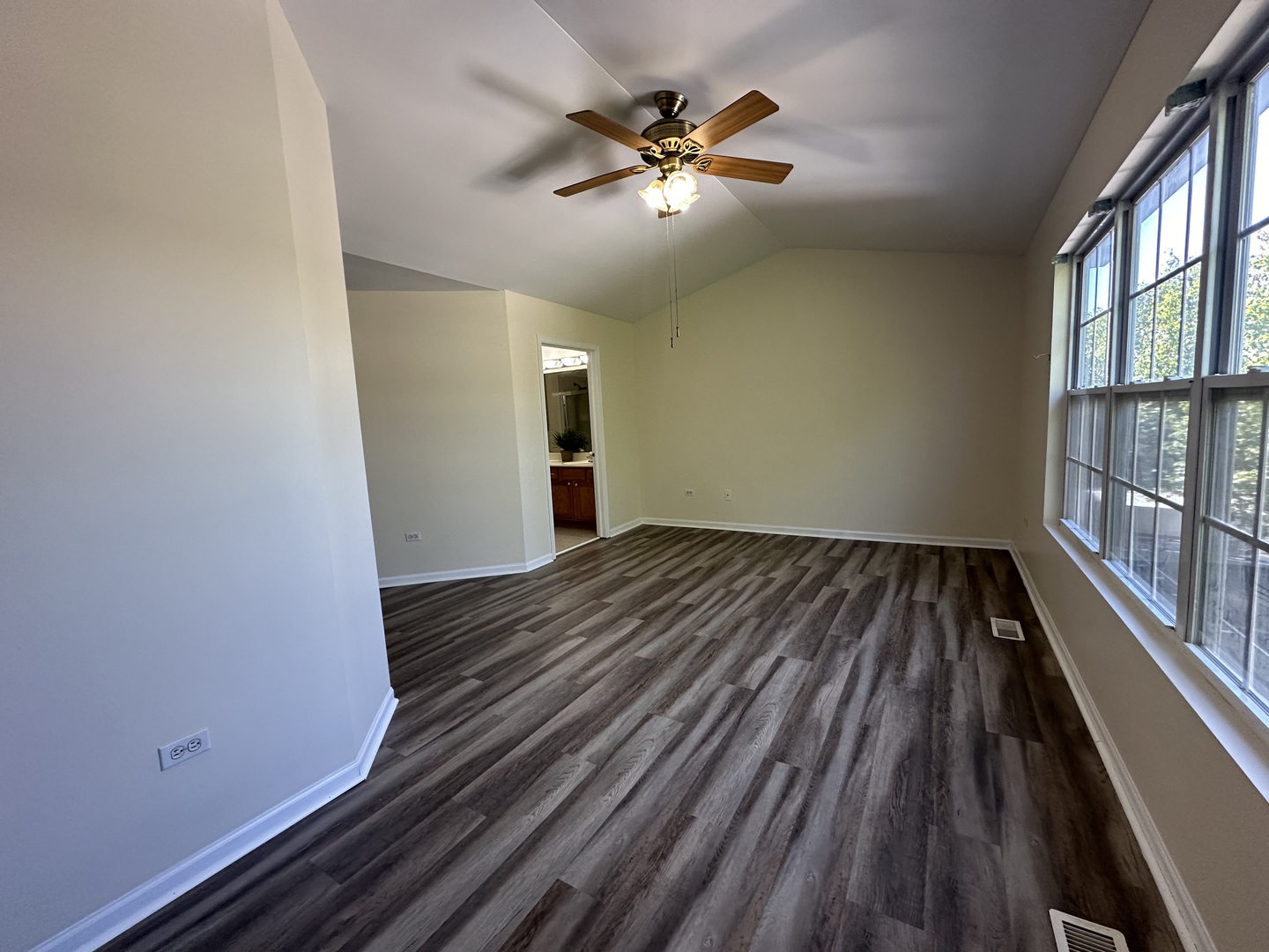 1525 Envee Drive Bolingbrook, IL 60490 - Photo 12 of 30 wooden floor in an empty room with a window