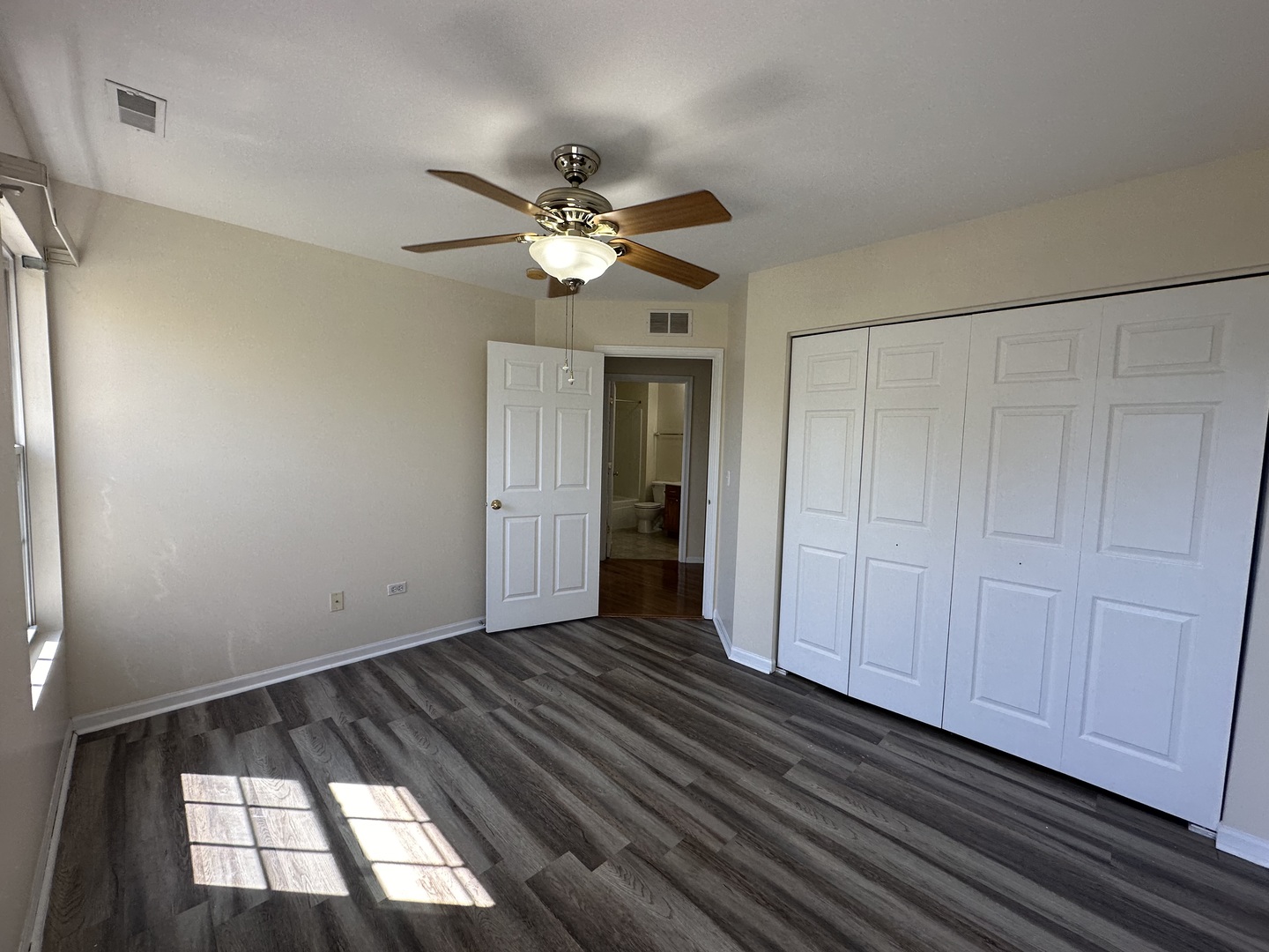 1525 Envee Drive Bolingbrook, IL 60490 - Photo 22 of 30 a view of empty room with wooden floor and fan