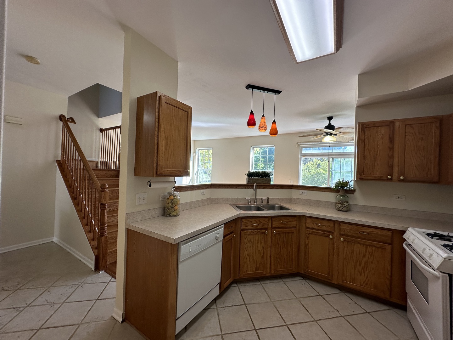 1525 Envee Drive Bolingbrook, IL 60490 - Photo 9 of 30 a kitchen with stainless steel appliances granite countertop a sink and a stove