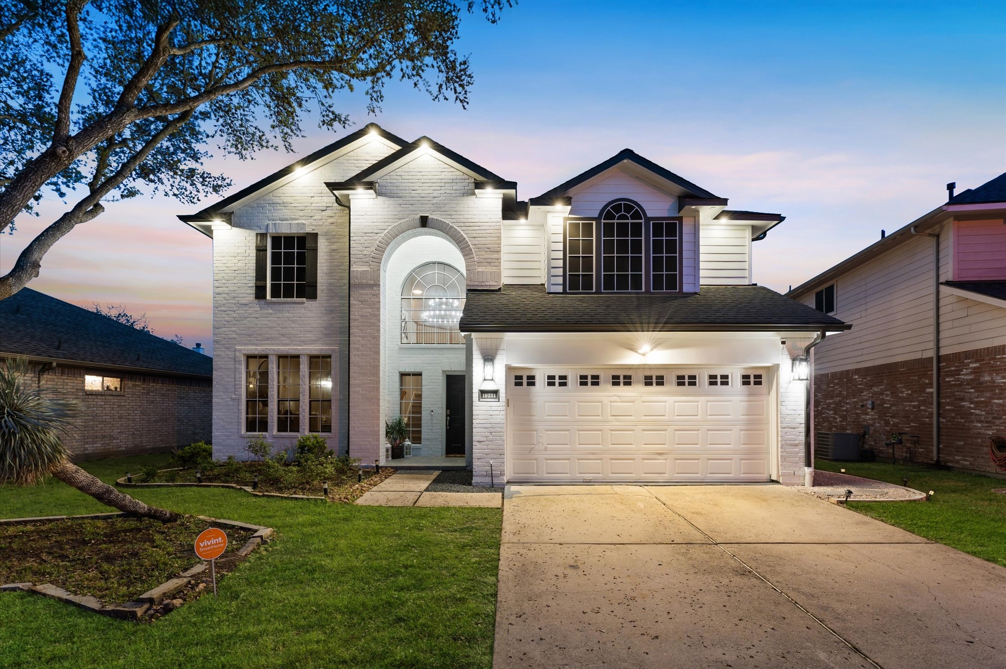 a front view of a house with yard