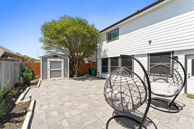 a kitchen with a sink a stove and cabinets