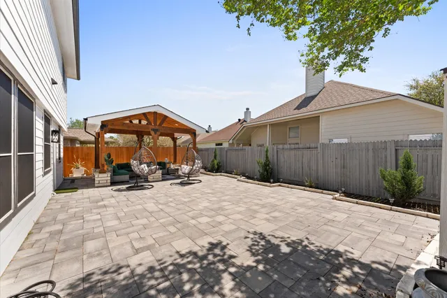 a kitchen with a table chairs sink and cabinets